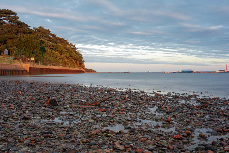 Southampton water at Royal Victoria Country park shoreline. The tide is going out.