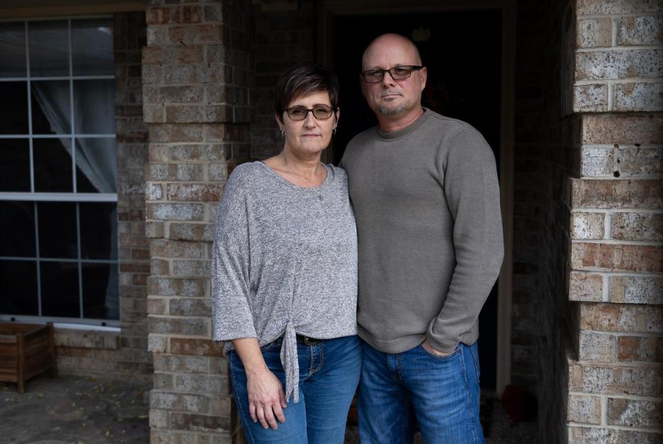 Michelle and Rodney Simington pose for a portrait outside their house on Dec. 7, 2023. Mike filed a medical malpractice lawsuit against Dr. Garcia, now his family is continuing with it. “I’m more angry than anything else. I’ve been angry since day one,” said Rodney as he explained his father’s case.