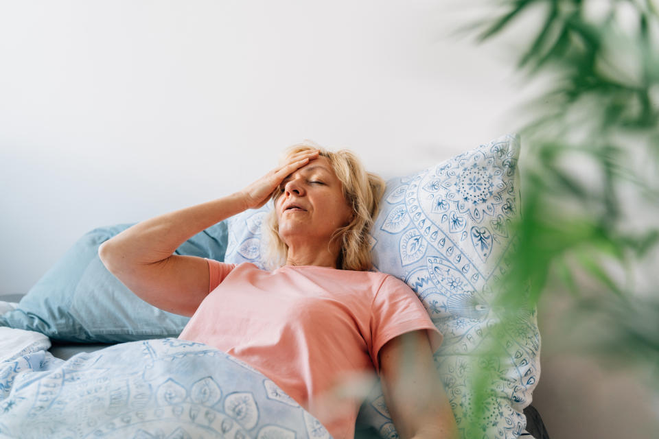 Middle aged woman having Hot flashes in bed. Hormone therapy is increasingly being used in Canada to treat symptoms of perimenopause and menopause. Here's what you should know about benefits and risks. (Image via Getty)