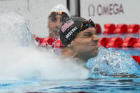 Caeleb Dressel, of United States, celebrates after winning the gold medal in the men's 50-meter freestyle final at the 2020 Summer Olympics, Sunday, Aug. 1, 2021, in Tokyo, Japan. (AP Photo/Gregory Bull)