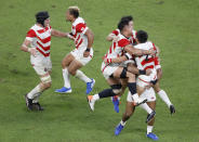 Japan's players celebrate after winning over Ireland during the Rugby World Cup Pool A game at Shizuoka Stadium Ecopa between Japan and Ireland in Shizuoka, Japan, Saturday, Sept. 28, 2019. (Kyodo News via AP)