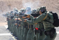 <p>U.S. Border Patrol trainees fire M-4 rifles during a weapons training class at the U.S. Border Patrol Academy on August 3, 2017 in Artesia, N.M. (Photo: John Moore/Getty Images) </p>