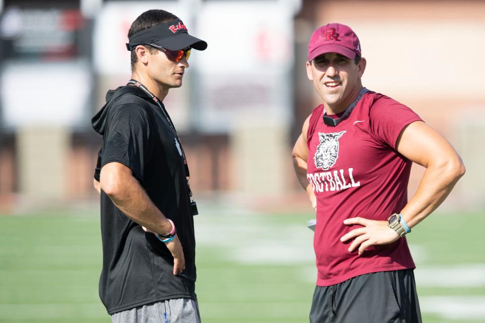 Maryville football coach Derek Hunt, left, and Oak Ridge football coach Derek Rang chat before the start of their scrimmage at Maryville on Friday, August 4, 2023.