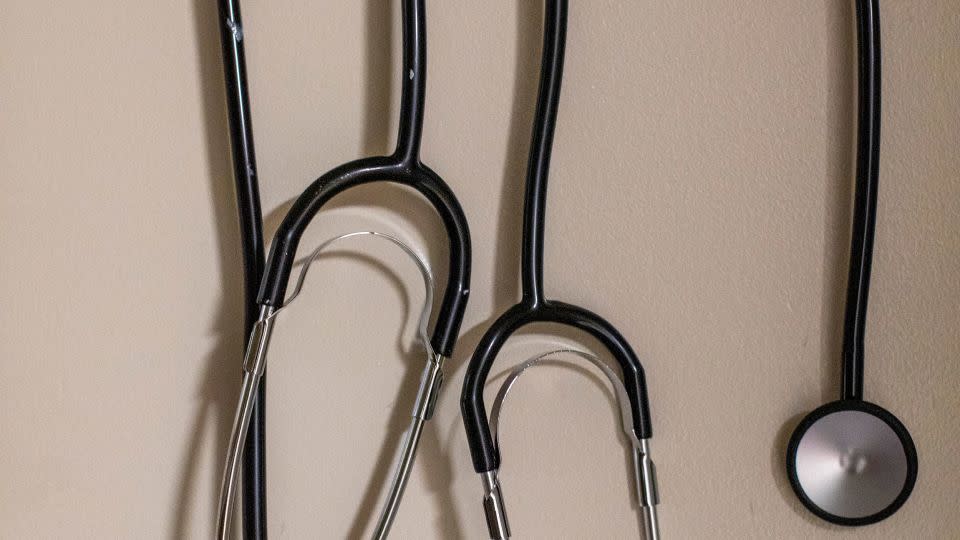 Stethoscopes hang on a wall inside a birthing room. - Alyssa Pointer for CNN
