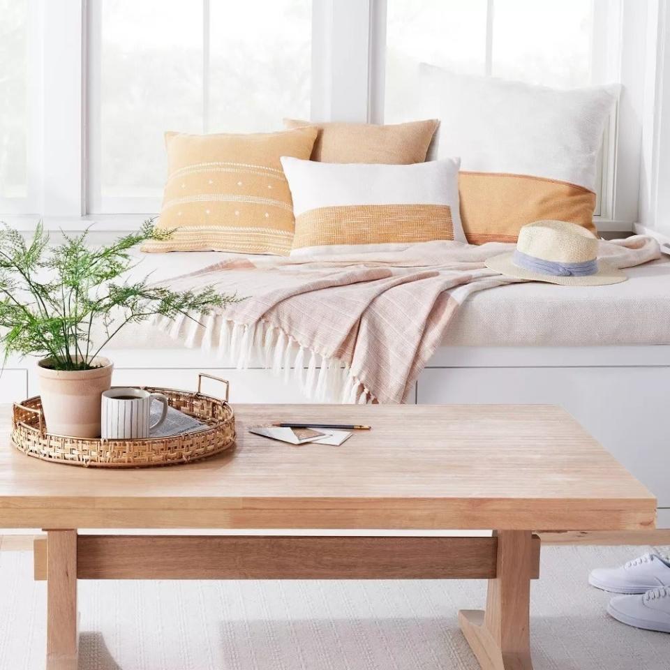 the light wood rectangular coffee table in a living room