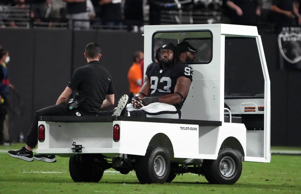 Las Vegas Raiders defensive tackle Gerald McCoy (93) is taken to the locker room after suffering an apparent injury against the Baltimore Ravens during the second half at Allegiant Stadium.