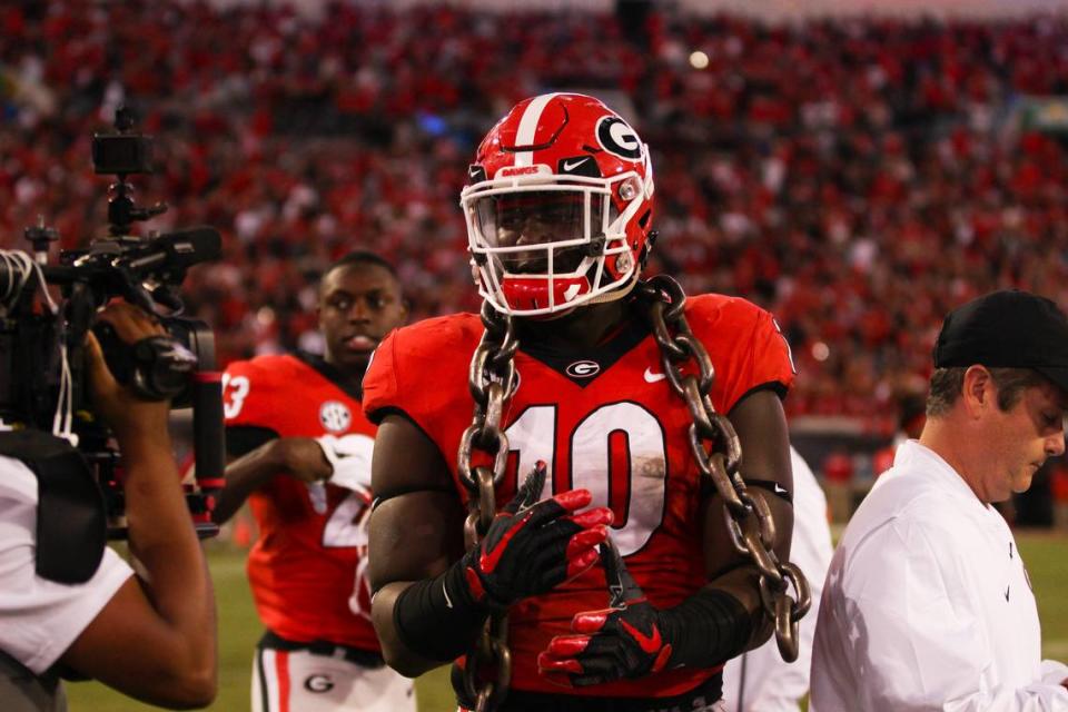 Georgia defensive lineman Malik Herring (10) heads to the locker room with a chain around his neck — a recognition for defensive players — after an NCAA football game between the University of Georgia Bulldogs and the University of Florida Gators in TIAA Bank Field in Jacksonville, Fl., on Saturday, Oct. 27, 2018.