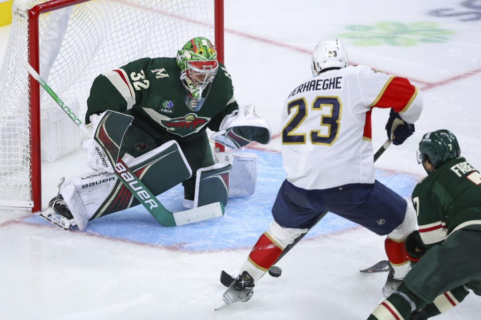 Minnesota Wild goaltender Filip Gustavsson (32) defends against Florida Panthers center Carter Verhaeghe (23) during the third period of an NHL hockey game Thursday, Oct. 12, 2023, in St. Paul, Minn. (AP Photo/Matt Krohn)