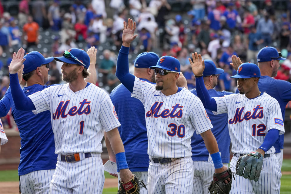 The New York Mets celebrate after defeating the Cincinnati Reds in a baseball game, Sunday, Sept. 17, 2023, in New York. (AP Photo/Mary Altaffer)