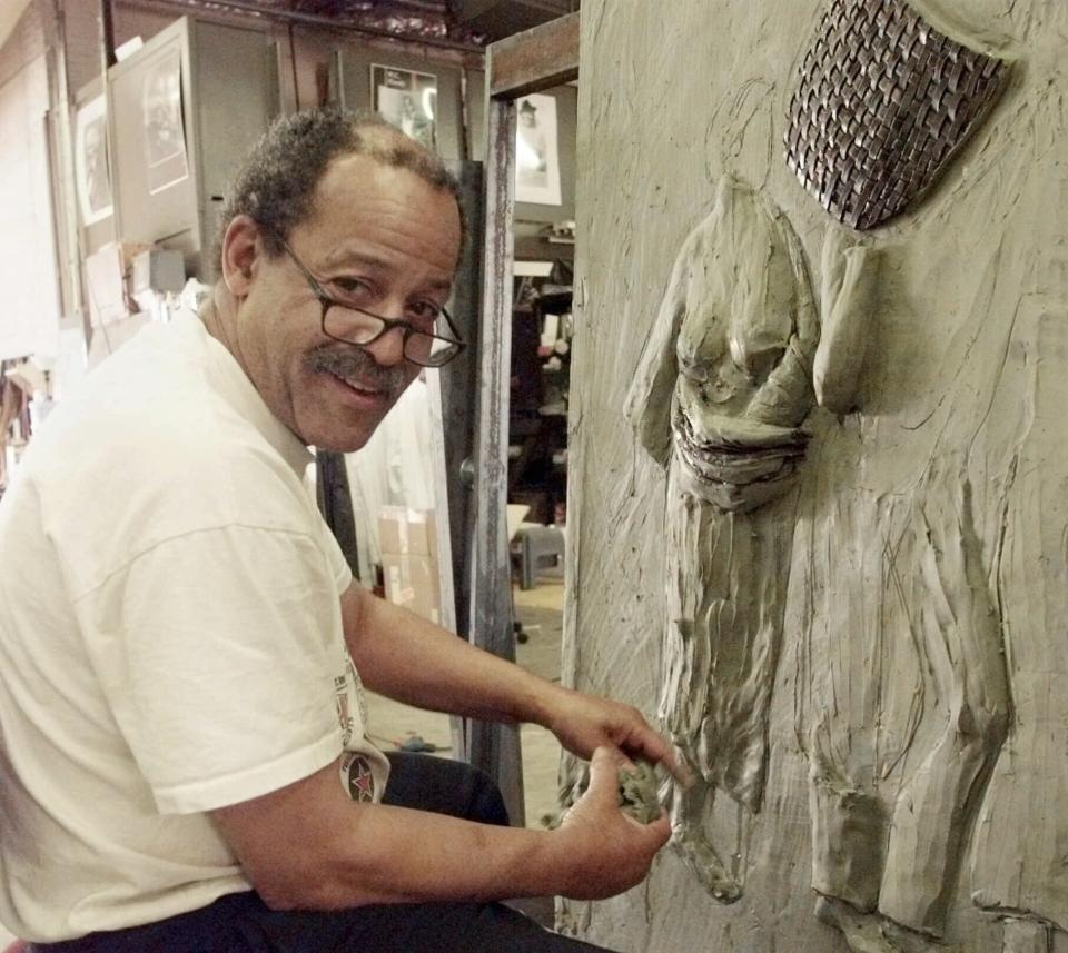 FILE - Sculptor and former astronaut Ed Dwight works on a piece in his studio in Denver, Colo., on Aug. 5, 1999. Dwight is featured in a documentary “The Space Race," which chronicles the stories of Black astronauts. (AP Photo/Ed Andrieski, File)
