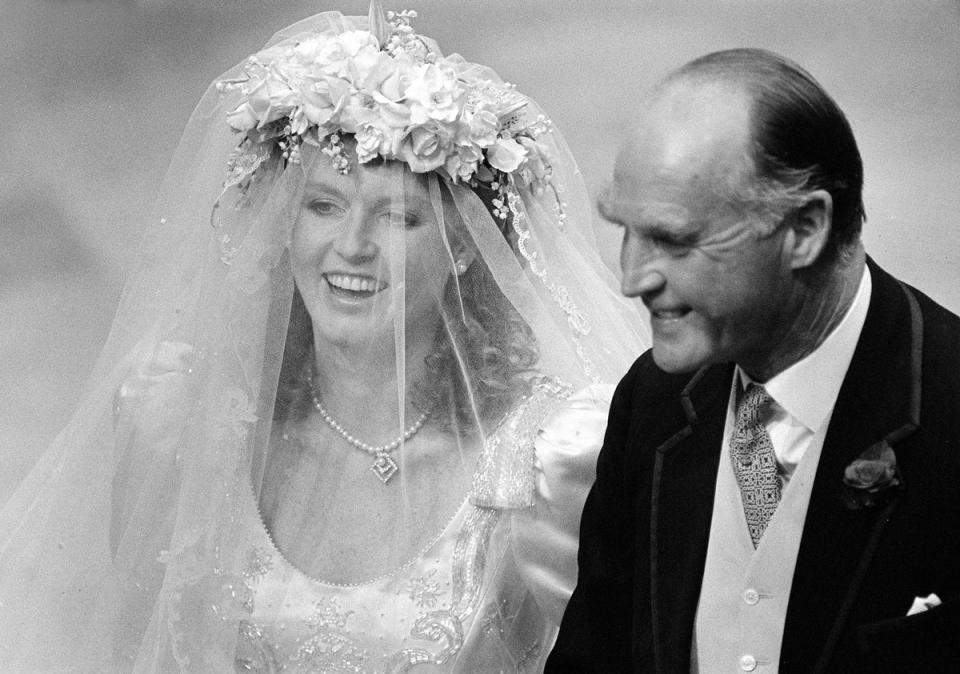 Sarah, Duchess of York with her father Major Ronald Ferguson on her wedding day to Prince Andrew, 1986 (PA)