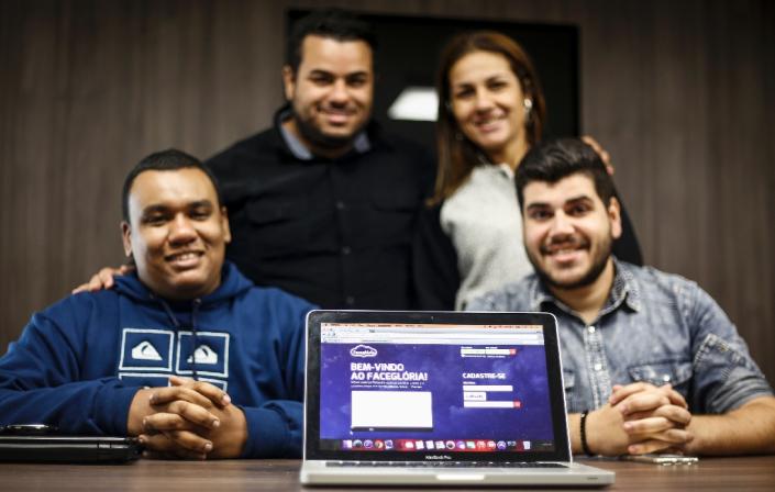 From left, Thiago, Davis, Daiane and Atilla, creators of Facegloria, a social network for evangelicals. (Photo: AFP Photo/Miguel Schincariol)