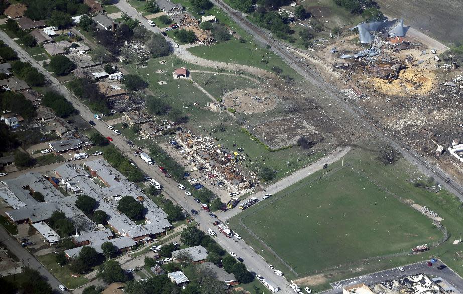 FILE - In this April 18, 2013 aerial file photo, the remains of a nursing home, left, apartment complex, center, and fertilizer plant, right, destroyed by an explosion at a fertilizer plant in West, Texas. The Trump administration is delaying a new rule tightening safety requirements for companies that store large quantities of dangerous chemicals. Environmental Protection Agency (EPA) Administrator Scott Pruitt has delayed the effective date of the Obama-era rule until June. (AP Photo/Tony Gutierrez, File)