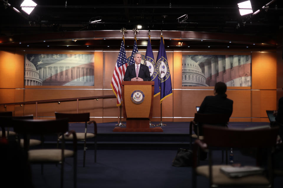 WASHINGTON, DC - MARCH 26: Reporters practice social distancing as House Minority Leader Kevin McCarthy (R-CA) holds a news conference about legislation addressing the coronavirus pandemic at the U.S. Capitol March 26, 2020 in Washington, DC. As people filed a record 3.2 million unemployment claims, McCarthy said he did not anticipate much opposition to a vote for a $2.2 trillion stimulus bill that lawmakers hope will shore up the economy in the face of the COVID-19 pandemic. (Photo by Chip Somodevilla/Getty Images)