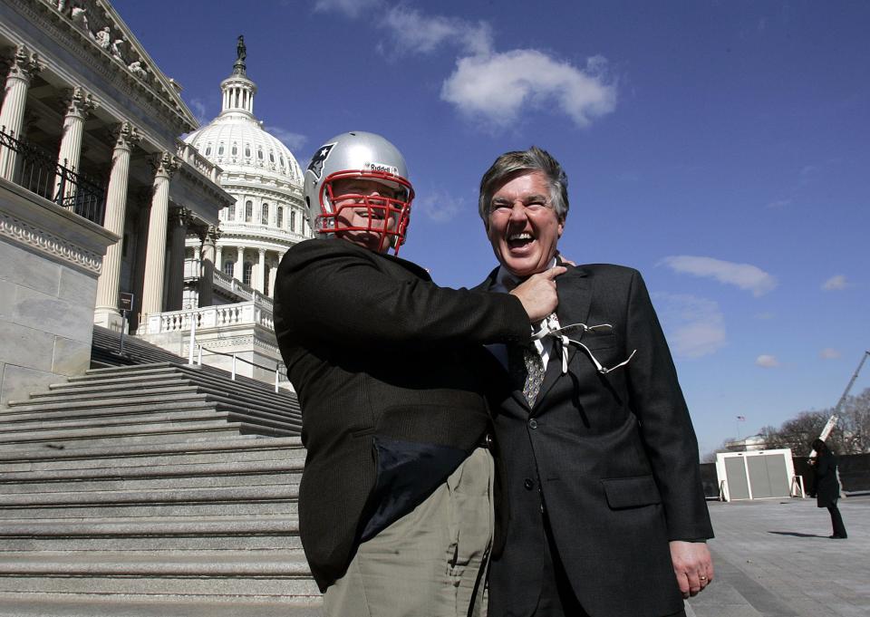 Bob Brady (D-PA) wears a New England Patriots helmet presented to him by Marty Meehan (D-MA) after their bet on Super Bowl XXXIX. (Getty)