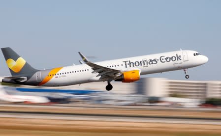 FILE PHOTO: A Thomas Cook Airbus A321 airplane takes off at the airport in Palma de Mallorca