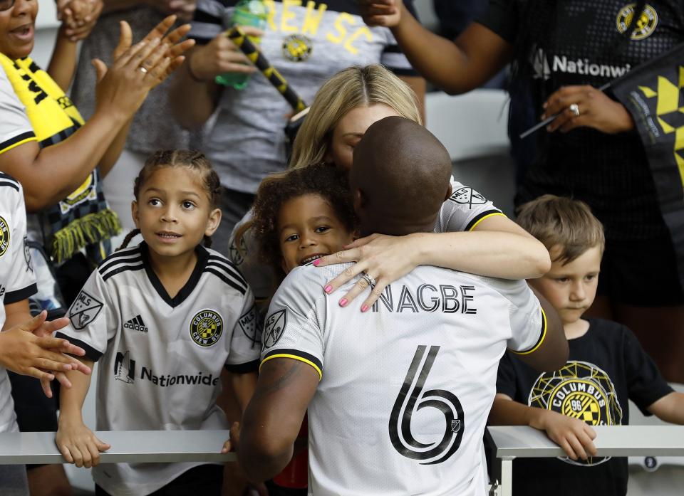 Columbus Crew midfielder Darlington Nagbe (6) hugs and kisses his family after a 2-2 tie against New England Revolution in their first  MLS game at Lower.com Field in Columbus, Ohio on July 3, 2021. 