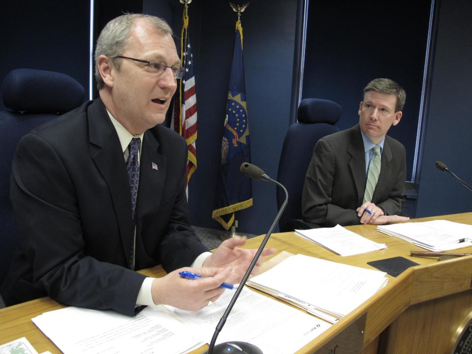 Public Service Commissioner Kevin Cramer, left, speaks on Wednesday, Feb. 29, 2012, during commission discussion of an Xcel Energy electric rate increase at a commission meeting in the agency's hearing room on the 12th floor of the North Dakota state Capitol in Bismarck, N.D. Listening on the right is Tony Clark, the PSC chairman. Xcel Energy provides electricity to Fargo, West Fargo, Grand Forks, Minot and some smaller North Dakota communities. (AP Photo/Dale Wetzel)