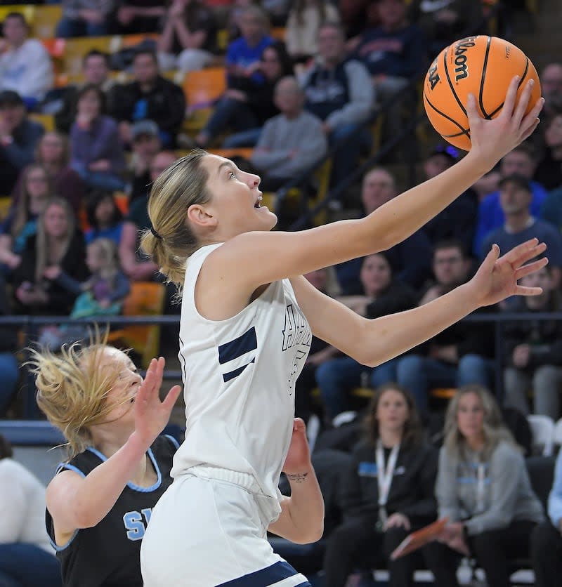 Ridgeline's Emilee Skinner shoots the ball as Sky View's Hannah Radford defends during the championship game of the Utah 4A girls basketball tournament on Saturday in Logan. | Eli Lucero, Herald Journal