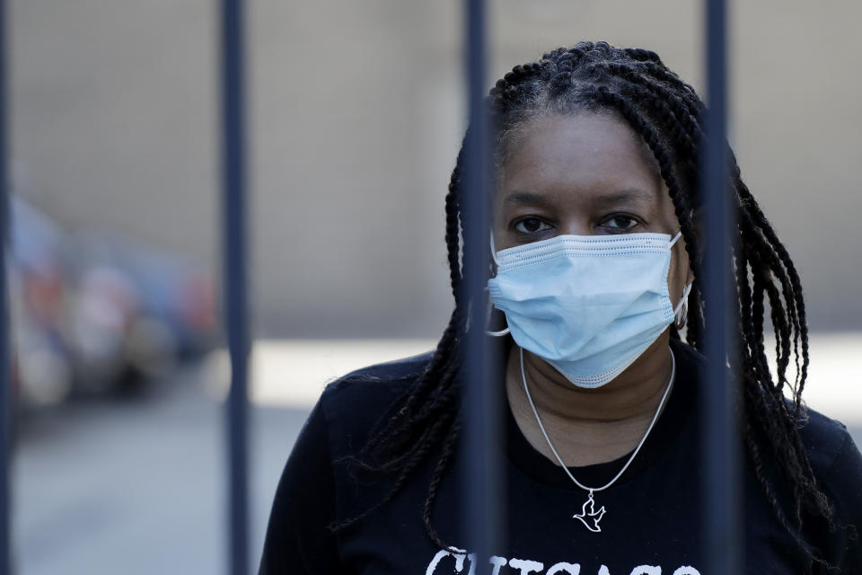 Roushaunda Williams poses for a photo in Chicago Thursday, July, 23, 2020. Financial challenges keep piling up for Williams months after she lost her job of nearly 20 years tending bar at the Palmer House Hilton Hotel in downtown Chicago. Potential reopening dates for the hotel have been pushed back, Williams said, and hospitality jobs remain scarce. (AP Photo/Nam Y. Huh)