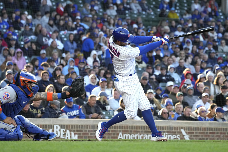 Chicago Cubs' Dansby Swanson hits a solo home run during the first inning of the team's baseball game against the New York Mets in Chicago, Thursday, May 25, 2023. (AP Photo/Nam Y. Huh)