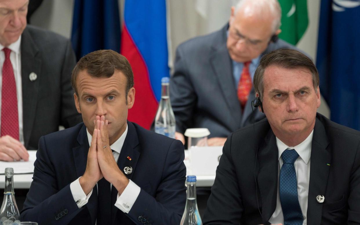 France's President Emmanuel Macron (L) and Brazil's President Jair Bolsonaro - AFP