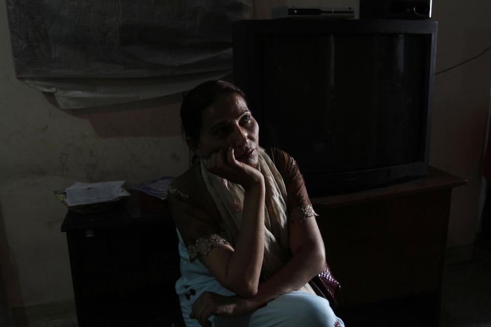 In this picture taken on Monday, April 15, 2013, Bindiya Rana, a transgender candidate in Pakistan's elections, listens to voters during a campaign in Karachi, Pakistan. When Rana went door to door in the Karachi slum she hopes to represent, few people seemed to care about which gender she identifies with. They were more interested in what she was going to do to combat the street crime and electricity outages in their neighborhood if elected.(AP Photo/Shakil Adil)