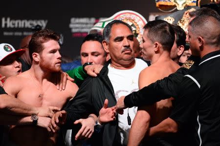 Sep 14, 2018; Las Vegas, NV, USA; Canelo Alvarez (left) and Gennady Golovkin face off during weigh ins for a middleweight world title boxing match at T-Mobile Arena. Mandatory Credit: Joe Camporeale-USA TODAY Sports