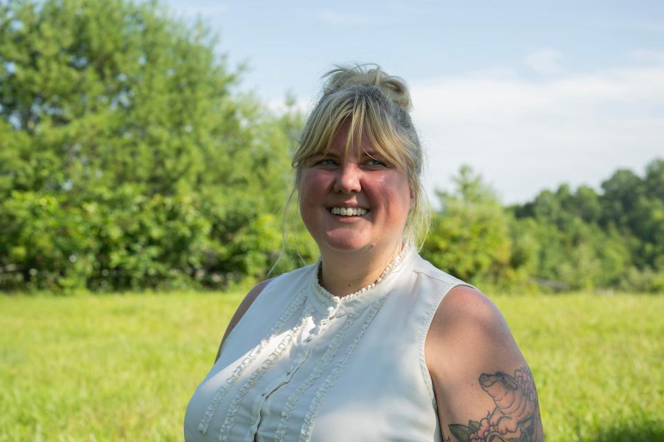 Lauren Hunter-Smith, a Kentucky "death doula," stands for a portrait following the first green burial at the Windy Knoll Memorial Sanctuary, where she provided emotional and logistical support. The Windy Knoll Memorial Sanctuary, which is the first green cemetery in the state of Kentucky, is in Lawrenceburg, and held this funeral on July 14, 2023.