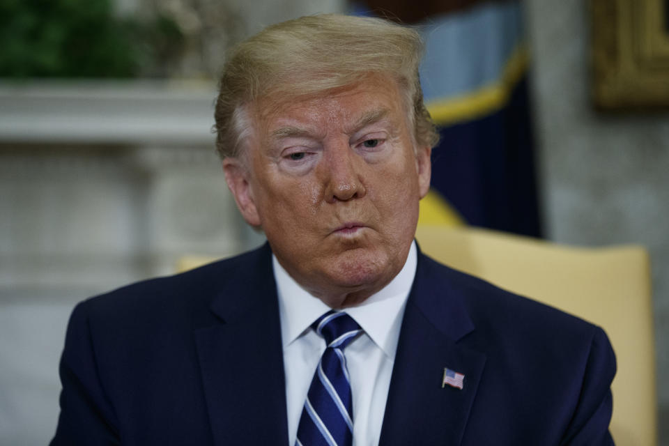 President Donald Trump listens to a question during a meeting with Canadian Prime Minister Justin Trudeau in the Oval Office of the White House, Thursday, June 20, 2019, in Washington. (AP Photo/Evan Vucci)