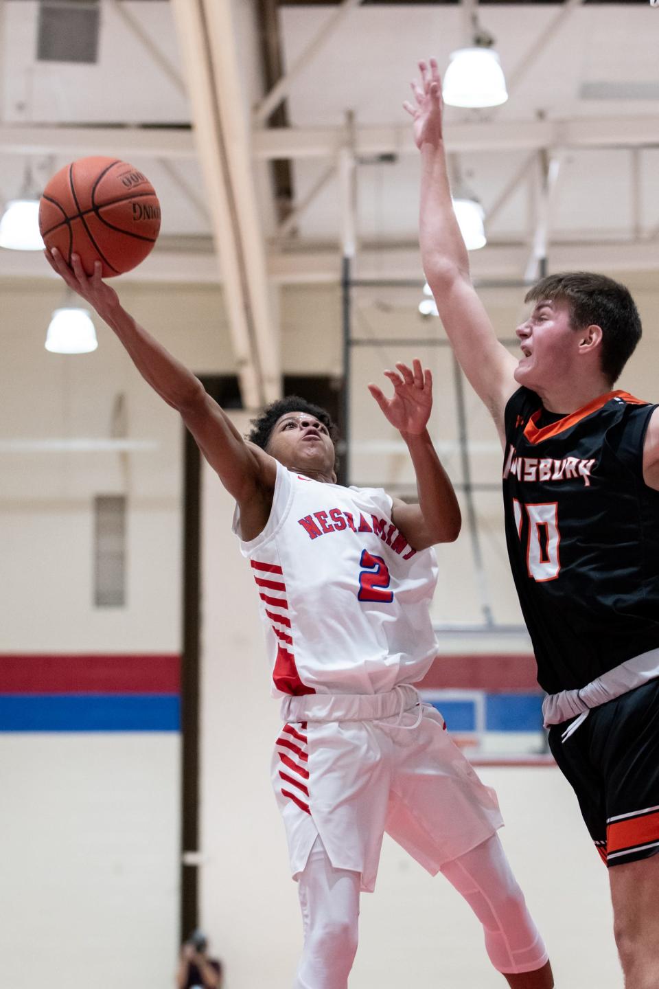 Neshaminy's Emeer Coombs shoots, as Pennsbury's Connor Taddei attempts to block, on Thursday, December 16, 2021, at Neshaminy High School in Langhorne. Neshaminy beat Pennsbury in triple overtime, 81-78.