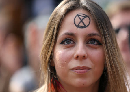 A climate change activist attends the Extinction Rebellion protest at Oxford Circus in London, Britain April 18, 2019. REUTERS/Simon Dawson