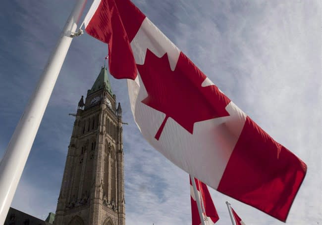 A Canadian flag flies on under the Peace Tower ahead of the resumption of parliament in Ottawa Wednesday March 3, 2010. It's back to the business of politics in Ottawa today with a throne speech from the Harper Conservatives. THE CANADIAN PRESS/Adrian Wyld