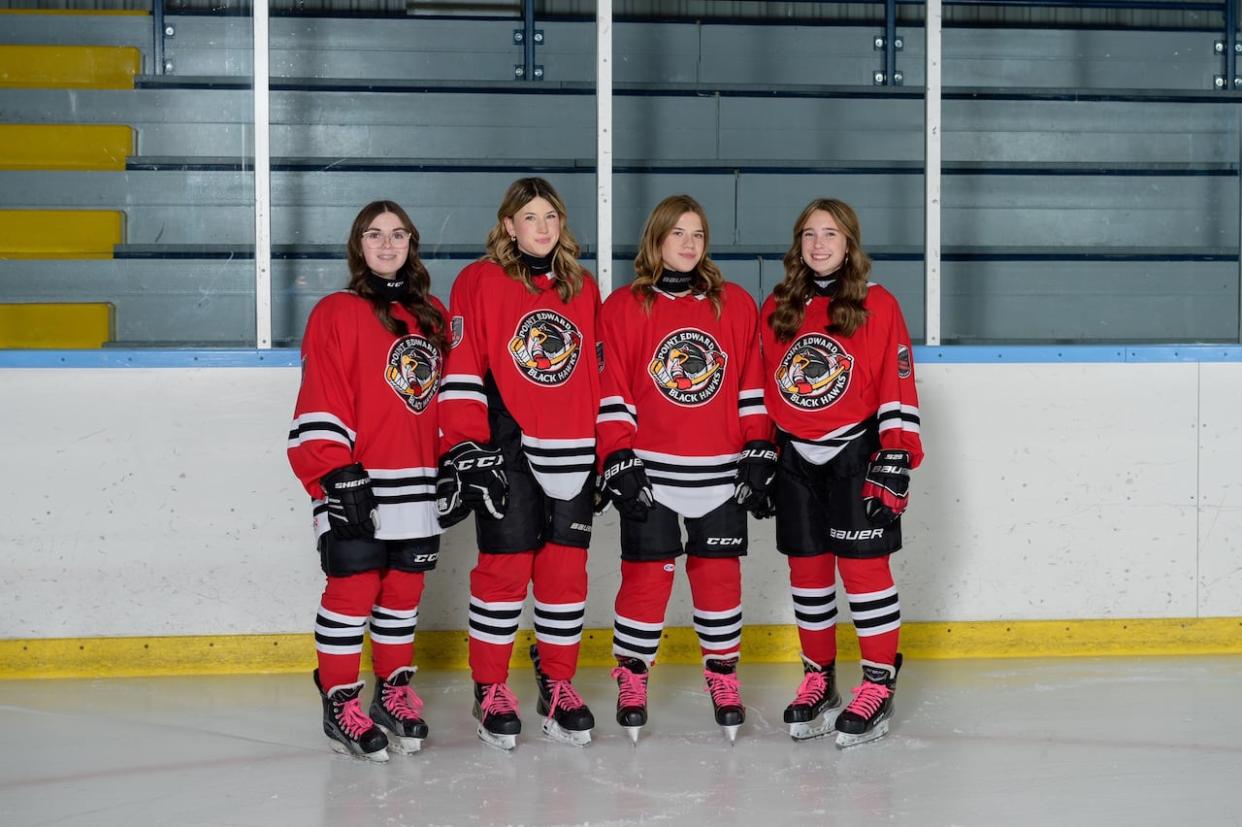 Four members of the Point Edward Black Hawks arrived to a tournament to find a tiny room set aside as their change room. From left to right is Gwyn Greer, Jamie Waun, Jocelyn Teixiera and Ava Lucas.   (Metcalfe Photography - image credit)