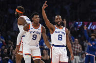 New York Knicks' Kemba Walker (8) celebrates with RJ Barrett (9) after making a three point basket during the first half of an NBA basketball game against the Boston Celtics Wednesday, Oct. 20, 2021, in New York. (AP Photo/Frank Franklin II)