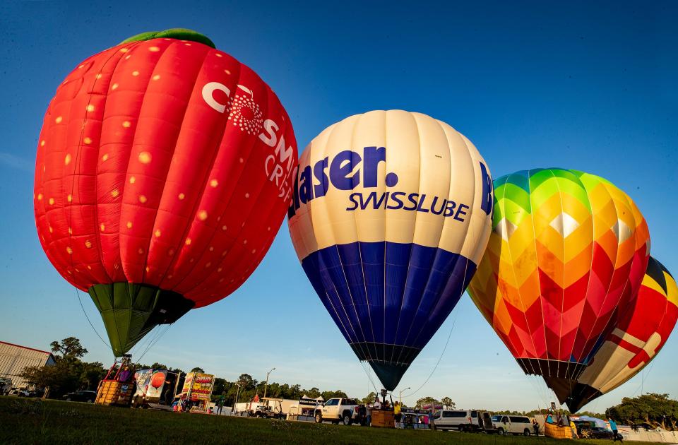 Balloon crews take off Friday morning at Lakeland Linder International Airport.