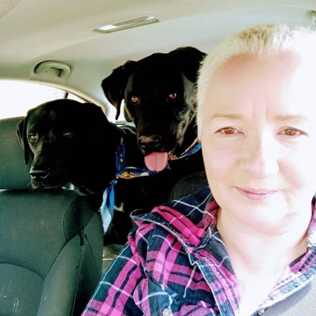 Cassandra Gould with her dogs Bambi, left, and Henri. Both dogs were in the car when Gould was killed in a collision on Saturday. Only Henri survived. (Submitted by Madison and Shelby Bragg - image credit)