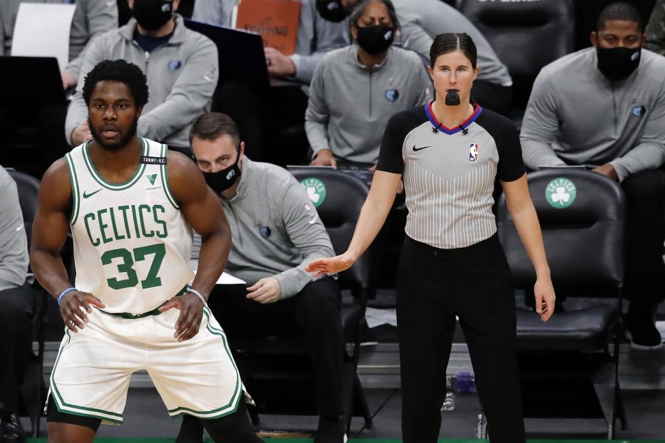 Referee Natalie Sago officiates behind Boston Celtics' Semi Ojeleye (37) during the first half of an NBA basketball game against the Memphis Grizzlies, Wednesday, Dec. 30, 2020, in Boston. (AP Photo/Michael Dwyer)