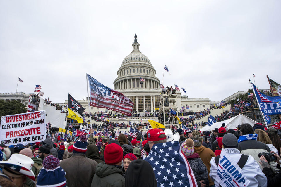 FILE - Rioters loyal to President Donald Trump rally at the U.S. Capitol in Washington on Jan. 6, 2021. Jean Lavin and her daughter Carla Krzywicki, both of Canterbury, Connecticut, pleaded guilty on Tuesday, Jan. 11, 2022, to parading, demonstrating or picketing, when they climbed a bicycle rack to get inside the Capitol building. (Jose Luis Magana / AP file)
