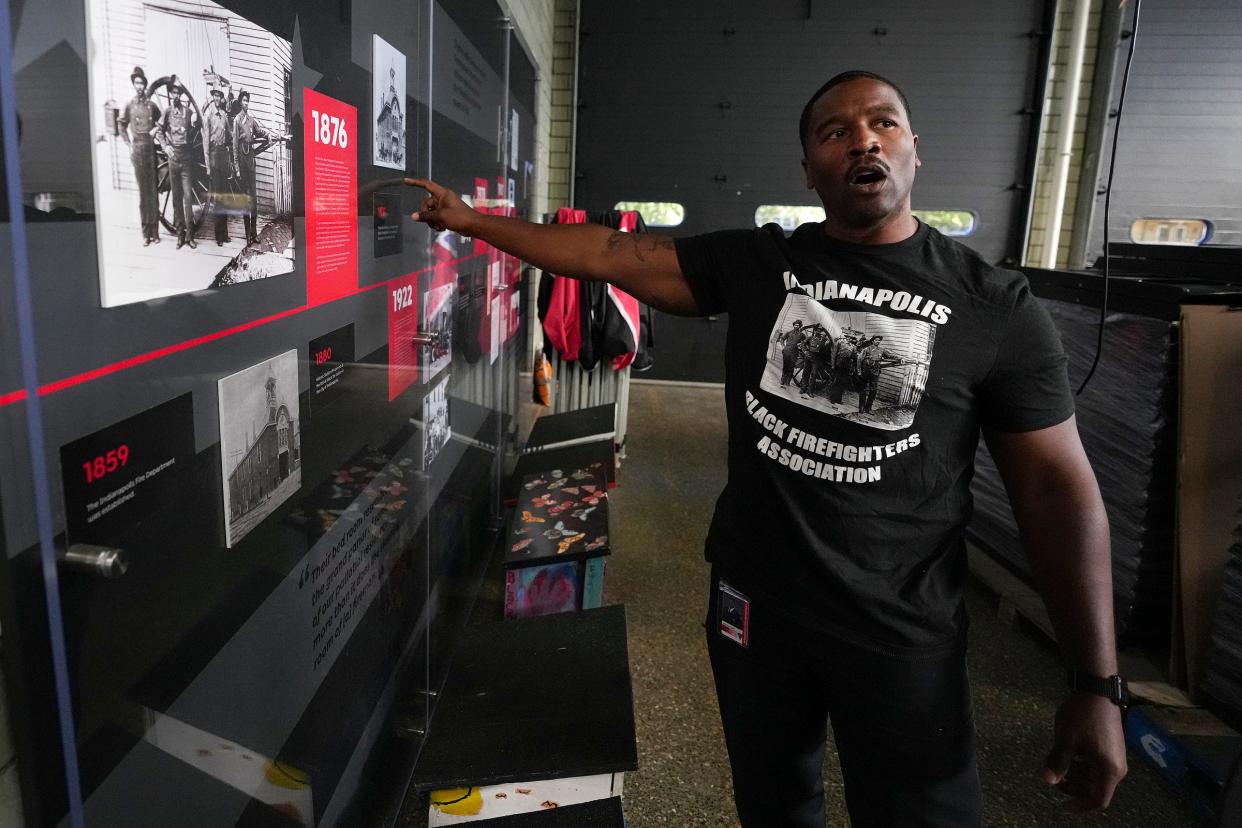 Corey Floyd, president of the Indianapolis Back Firefighters Association, shows off the beginnings of a visual history display that will highlight how Black firefighters helped shape the city's department Friday, Sept. 1, 2023, at old Station 31 on E. 46th Street. Floyd grew up just down the street and as a child, would walk over from playing baseball at the neighboring fairgrounds for cookouts at Station 31. He sees the project as one way to give back to the community that gave to him, and is passionate about increasing diversity in firefighting.