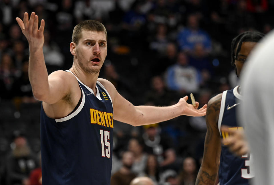 DENVER, CO - FEBRUARY 14: Nikola Jokic (15) of the Denver Nuggets questions a jump ball call during the fourth quarter of Denver