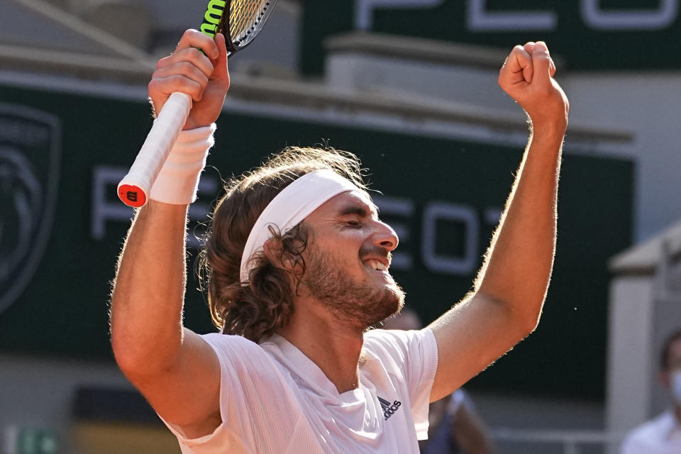 Stefanos Tsitsipas of Greece celebrates as he defeats Germany's Alexander Zverev during their semifinal match of the French Open tennis tournament at the Roland Garros stadium Friday, June 11, 2021 in Paris. (AP Photo/Michel Euler)