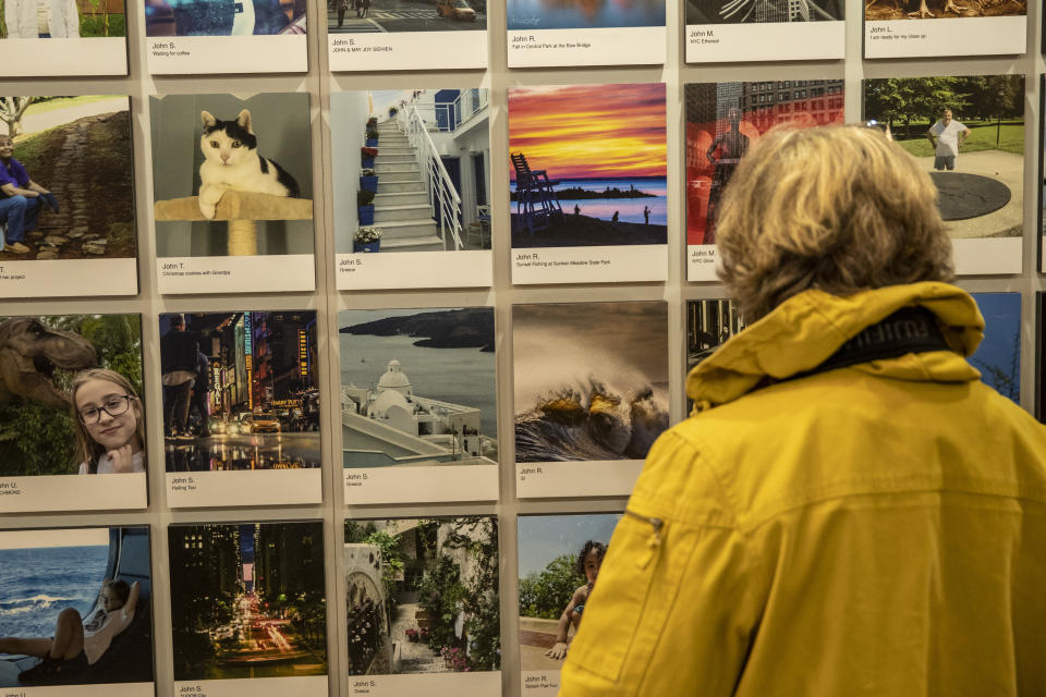 A woman admires several of the beautiful landscapes on exhibit at Vanderbilt Hall. (Photo: Gordon Donovan/Yahoo News)