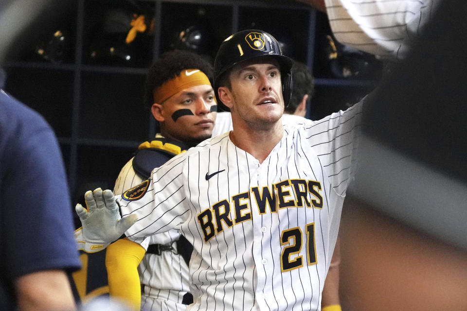 Milwaukee Brewers' Mark Canha (21) is congratulated after he scored against the Philadelphia Phillies during the second inning of a baseball game Saturday, Sept. 2, 2023, in Milwaukee. (AP Photo/Kayla Wolf)