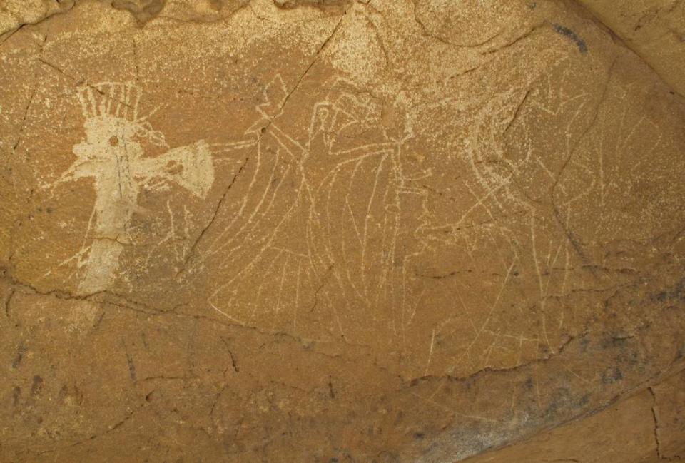 Petroglyphs of ceremonial weapons and a birdman figure (Credit: Alan Cressler)