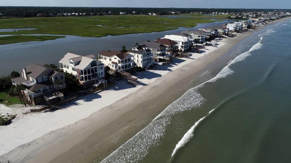 Litchfield Beach on Friday, September 6, 2019 after Hurricane Dorian washed away dunes, damaged a seawall and destroyed decks in front of the homes. Climate change hasn’t stopped new seaside development in the Carolinas.