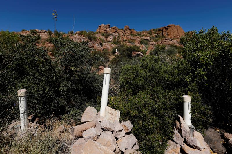 FILE PHOTO: FILE PHOTO: Stakes mark a mining claim in the Oak Flats area near Superior, Arizona