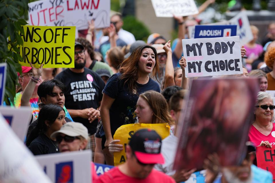 A police line separated abortion rights and anti-abortion demonstrators Saturday, June 25, 2022, at the Indiana Statehouse in Indianapolis. Remaining demonstrators from the morning's abortion rights rally approached the afternoon's anti-abortion rally, after marching the city. 