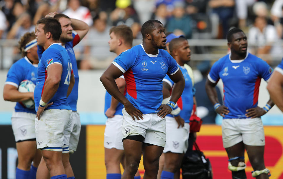 Namibian players react during the Rugby World Cup Pool B game at Tokyo Stadium between New Zealand and Namibia in Tokyo, Japan, Sunday, Oct. 6, 2019. The All Blacks defeated Namibia 71-9. (AP Photo/Christophe Ena)