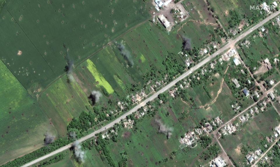 Artillery shells exploding around town (note smoke) of Dolyna, northwest of Slovyansk (Satellite image ©2022 Maxar Technologies.)